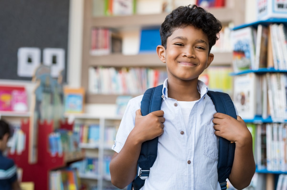 An image of a school child smiling